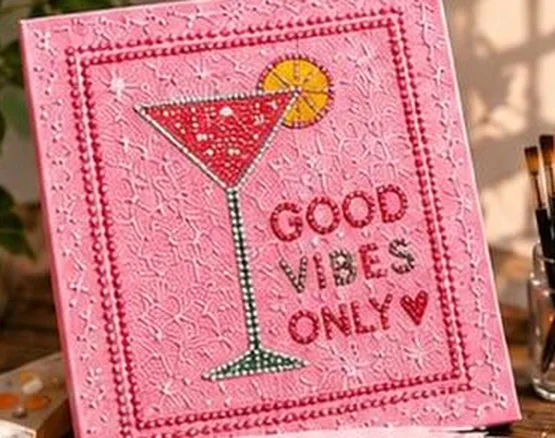 Pink bedazzled canvas with a cocktail glass and the words Good Vibes Only